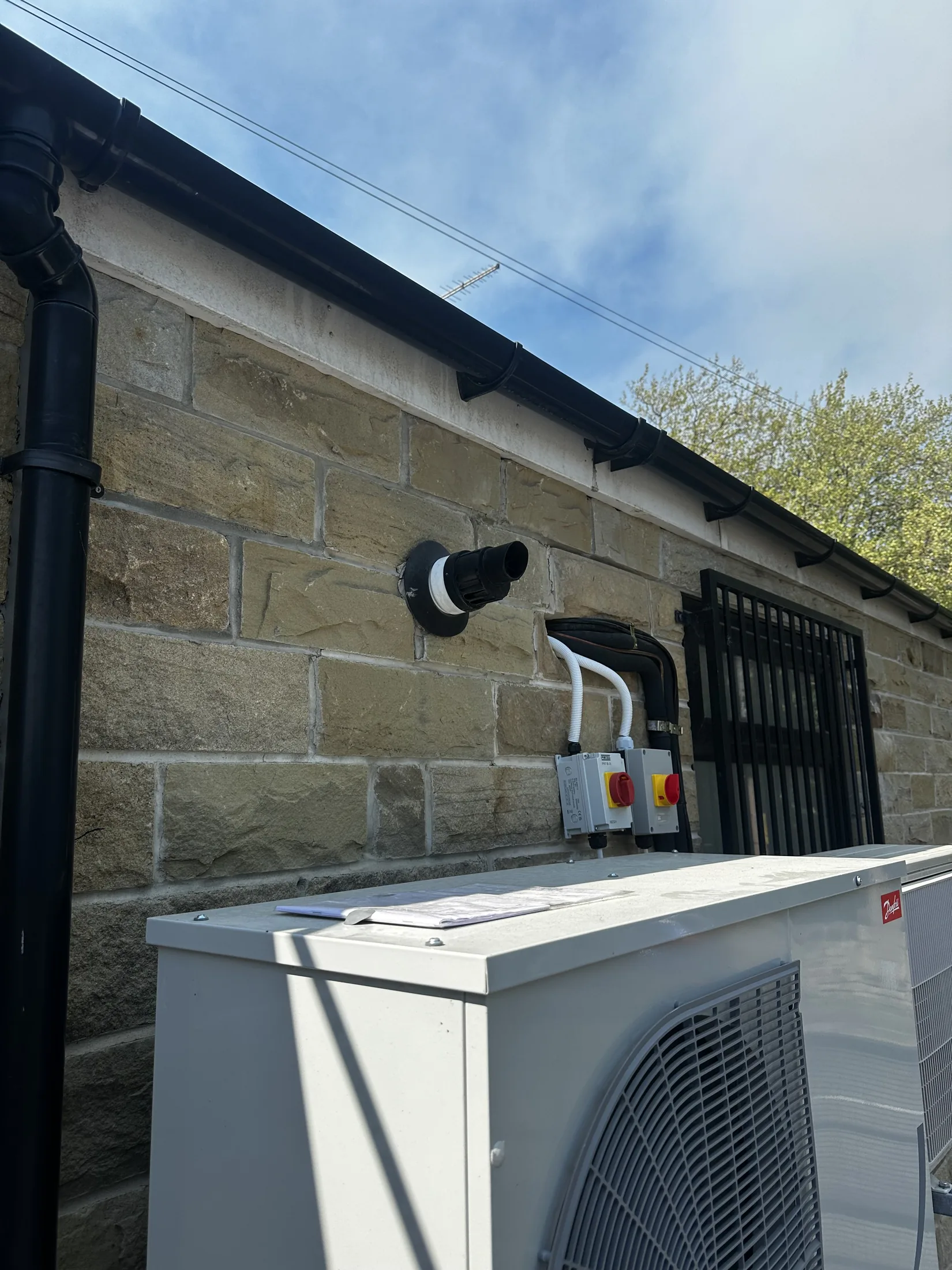 Two rotary isolators mounted above outdoor equipment units